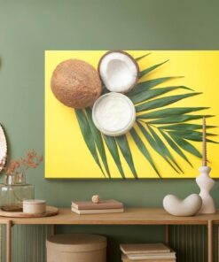 Leinwandbild Blatt- Und Kokosnussfrucht Auf Gelbem Hintergrund